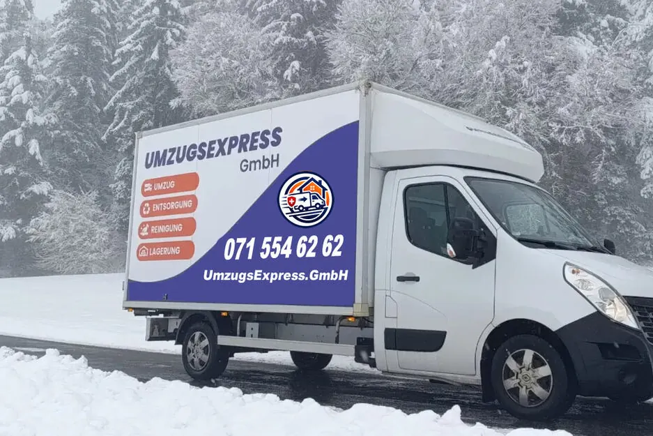 Moving van on a snowy road in winter